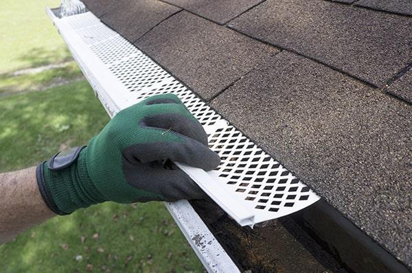 gutter guards help to maintain proper water flow by preventing blockages caused by debris